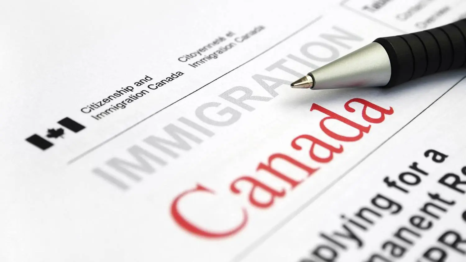 Canadian Citizenship An applicant is filling a Canadian citizenship application form